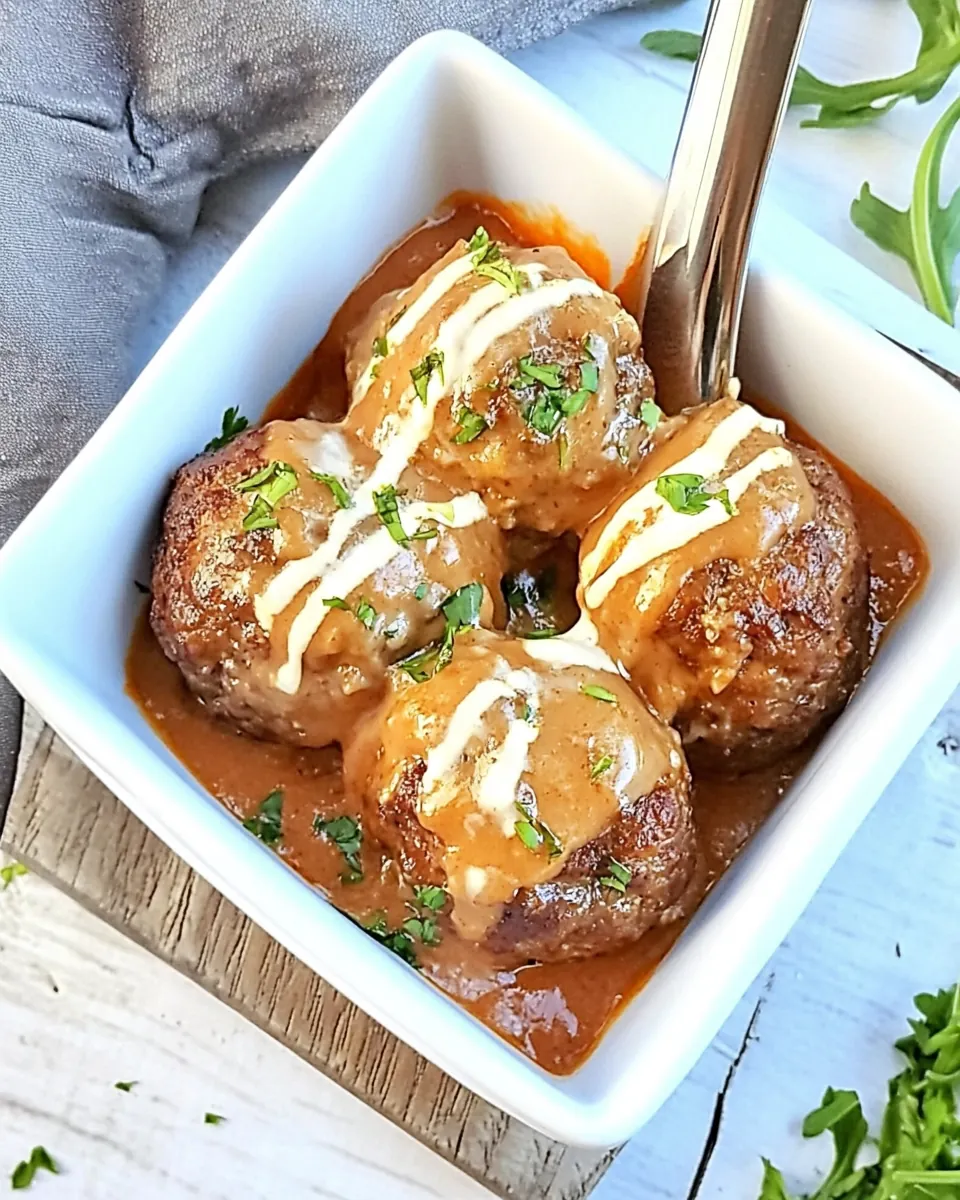 Cheese Stuffed Meatballs with a Creamy Tomato Sauce