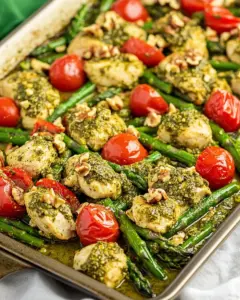 Sheet Pan Pesto Chicken with Asparagus Tomatoes and Walnuts